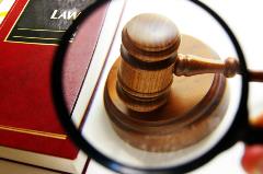 Gavel Under a Magnifying Glass